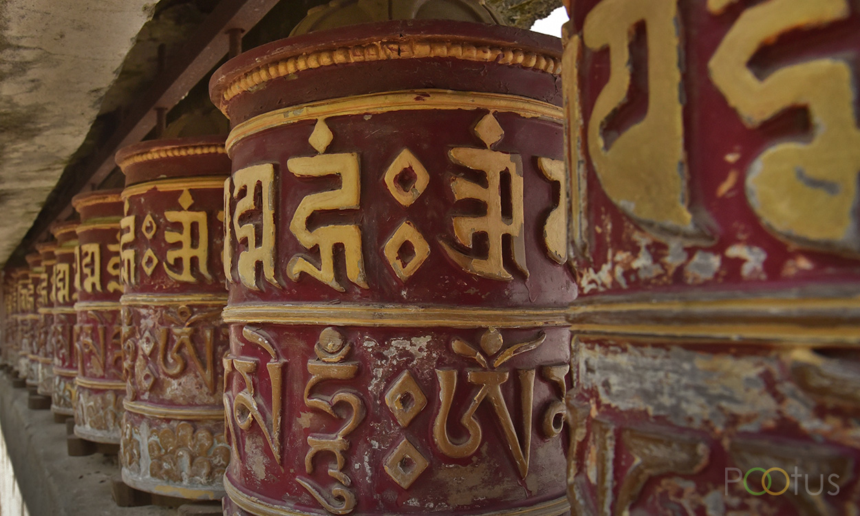 Spinning prayer wheels at Rumtek Monastery